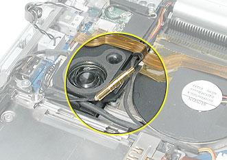 Pull out the coupling (joining the AirPort Extreme jumper and antenna cable) from the channel in the side of the left