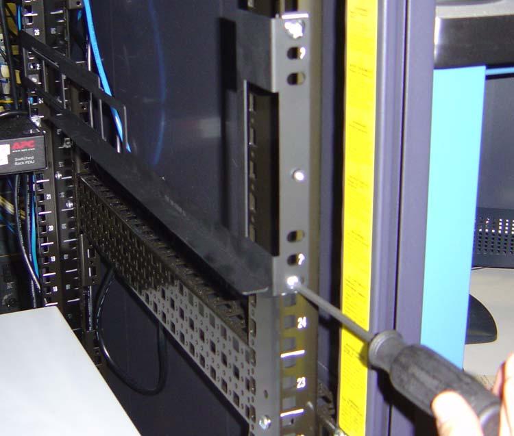 6 10. Screw the top and bottom of the front of the rails to the rack but do not fully tighten the screws. Figure 1-4 displays the rail loosely connected to the rack.