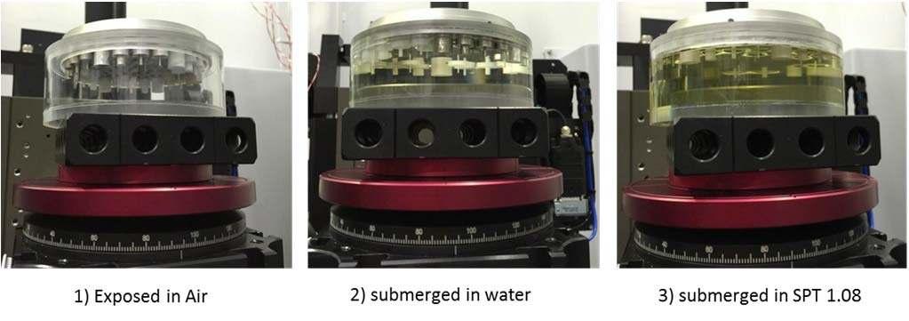 Fig. 2 Prototyped material standard assembled by cylindrical features submerged in medium with different density.