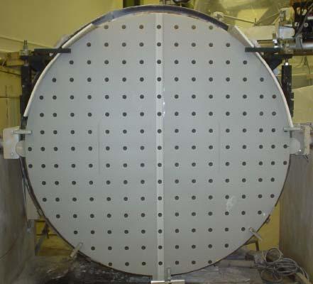 124 Figure 5.1: An example of a fiducial mask with regularly spaced holes. 5.2.2 High frequency features The other approach is to use high-frequency features on a surface for registration.