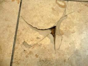 Fig.. Chips near edges and breaking of the tiles. The damages shown cannot be clearly, without tests, classified as material defects or manufacturing defects.