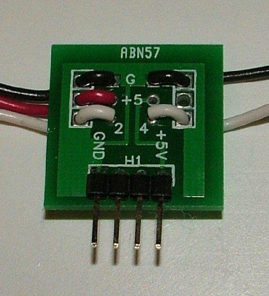 Figure 23. The terminator for a sensor array. The wires on the left and right sides connect to sensor PCBs. These will be added later. Figure 24. A sensor array plugged into a flight computer.