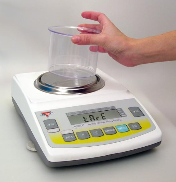 To perform check weighing place your object on the pan to check whether the weight of the object falls within the designated range.