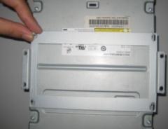 bars as shown below: Step 2: Loosen the four screws in the back of the front panel as shown below and then