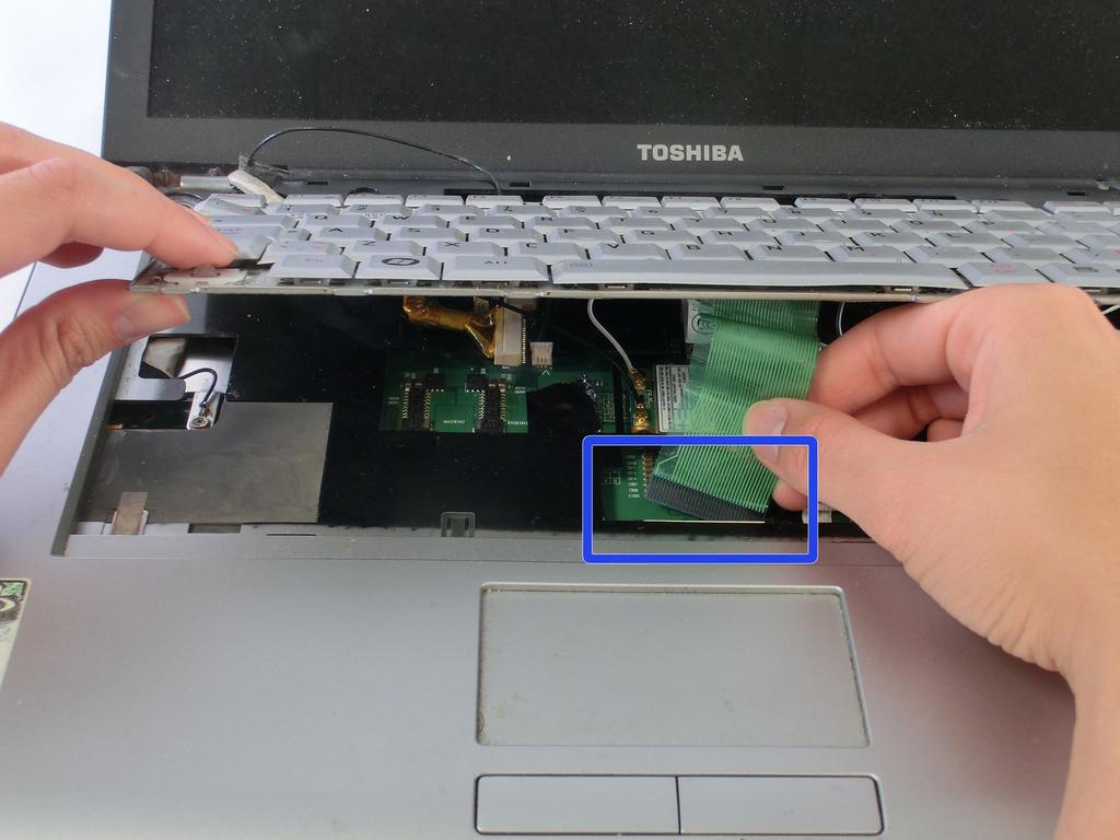 Toshiba Satellite A210 Fan Replacement Step 7 Disconnect the keyboard ribbon cable and remove the keyboard from the laptop.