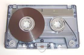 Magnetic tapes A magnetic tape is a very thin strip of plastic which is coated in a magnetic layer.they are read and written to by a read/write head.