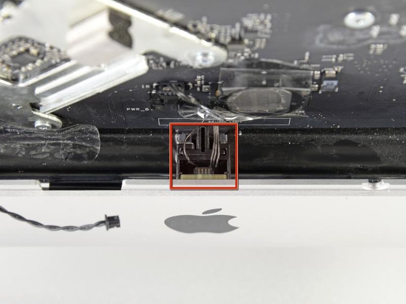 Step 28 Locate the IR sensor located behind the black apple logo.