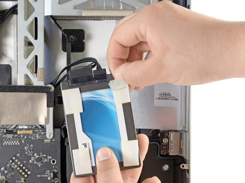 Carefully set the SSD into the imac optical bay as close to the lower left corner as possible.