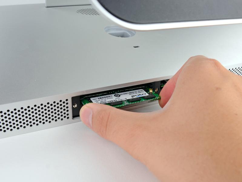Use your fingers to slide the RAM module out of its socket.