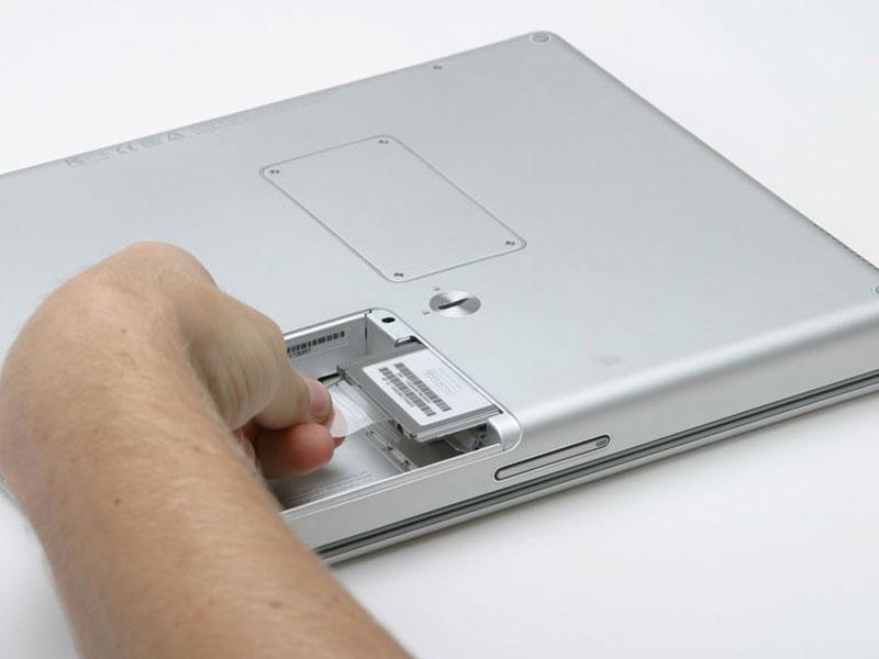 Step 6 Grasp the plastic tab and pull the
