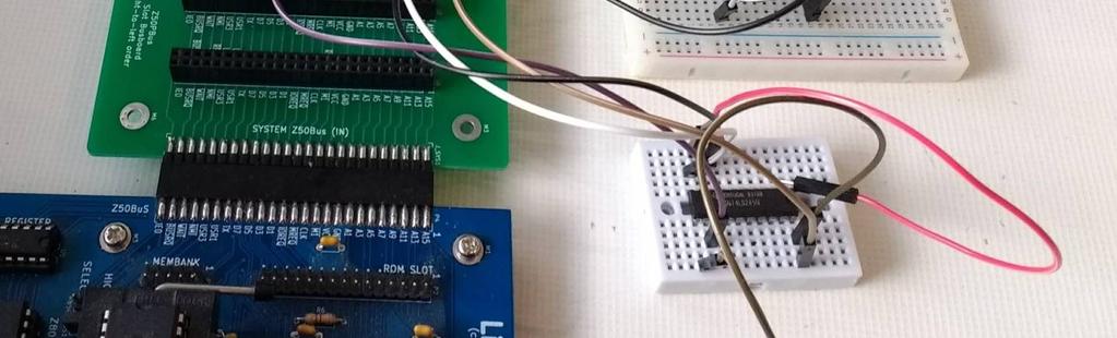 The breadboard on the left provides an input to the data bus, while the breadboard on the right provides an output from the data bus to drive an LED.