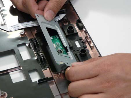 5. Rotate the TouchPad bracket upward as shown, and lift it clear of the Upper Cover.