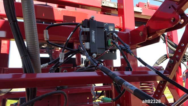 Route the opposite end of the Hardi Spray II Breakout Adapter, PN: 4004449-6 toward Ag Leader Control Modules mounted on the boom frame to the right front