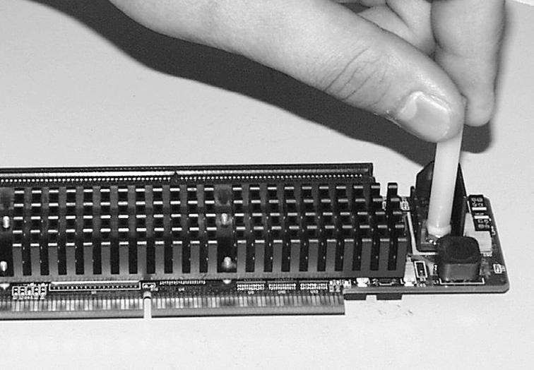Remove the access port cover (if installed) from the middle NuBus port located at the back of the computer (Figure 18).