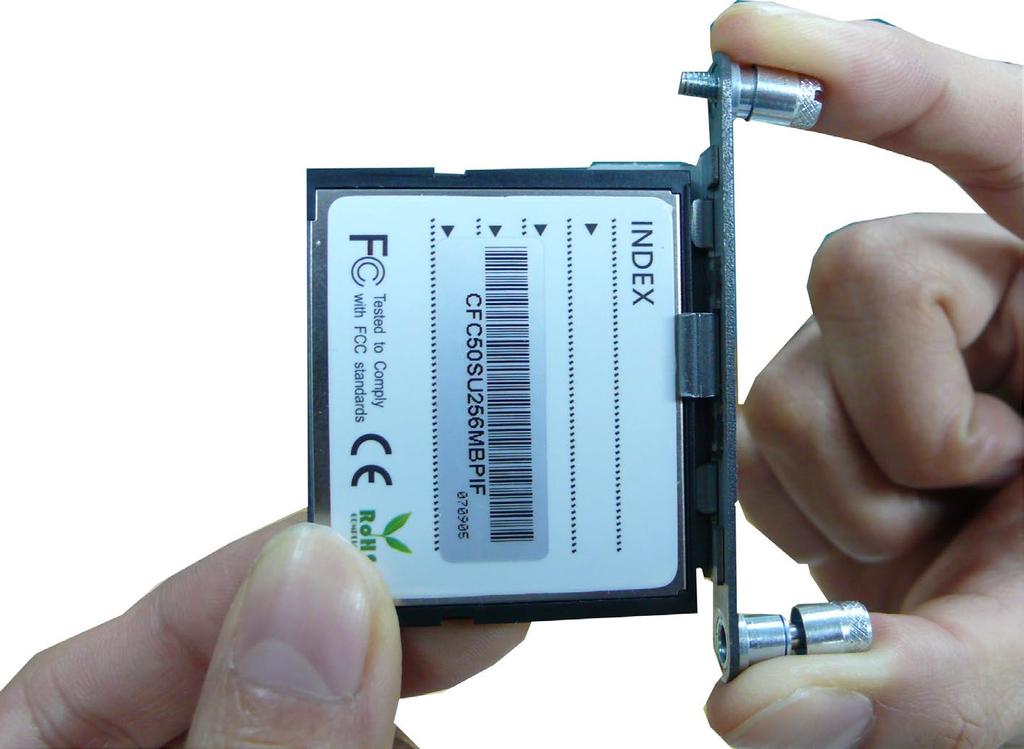 Insert the CompactFlash protective cover with the CompactFlash card into the socket, as shown in the figure.