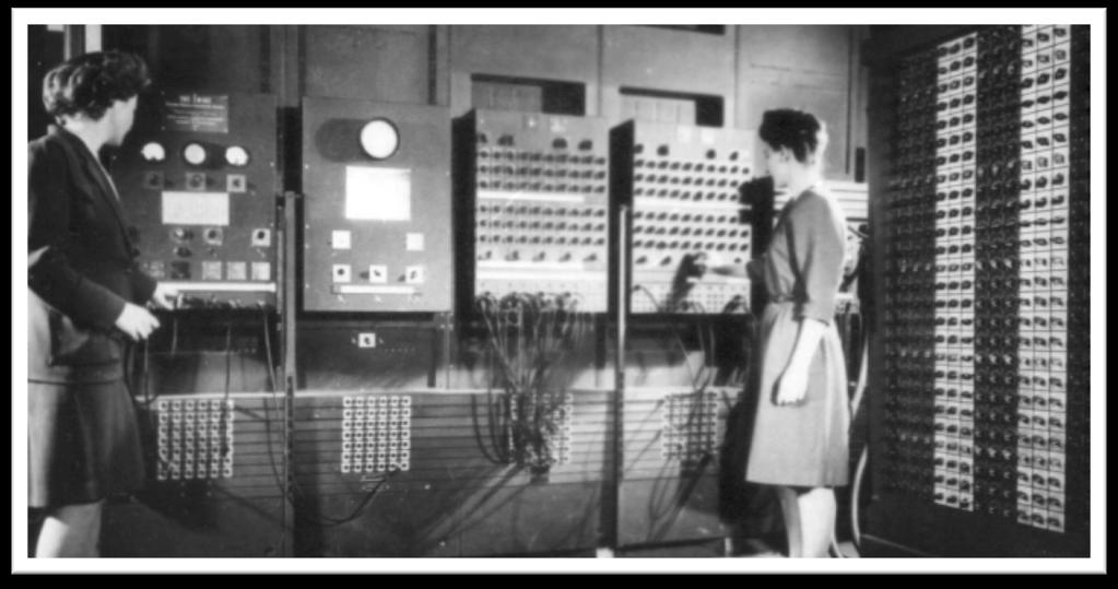 Programmers Betty Jean Jennings (left) and Fran Bilas (right) operate ENIAC's main control panel at