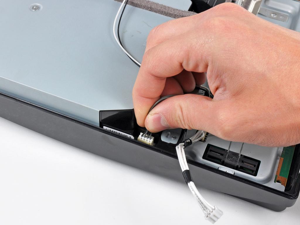 Pull the Blu-ray power cable straight up to lift its connector out