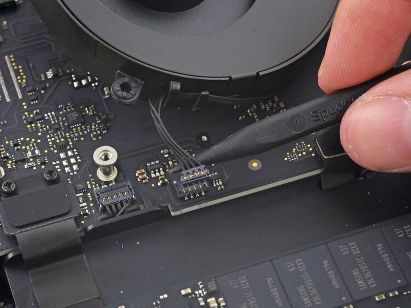 Pull the fan away from the SSD until you can easily access the fan connector.