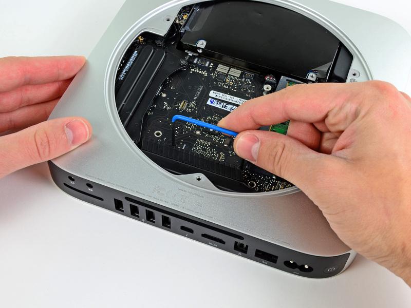 Be sure it makes contact with the top side of outer case below the logic board before proceeding. Carefully pull the tool toward the I/O board.