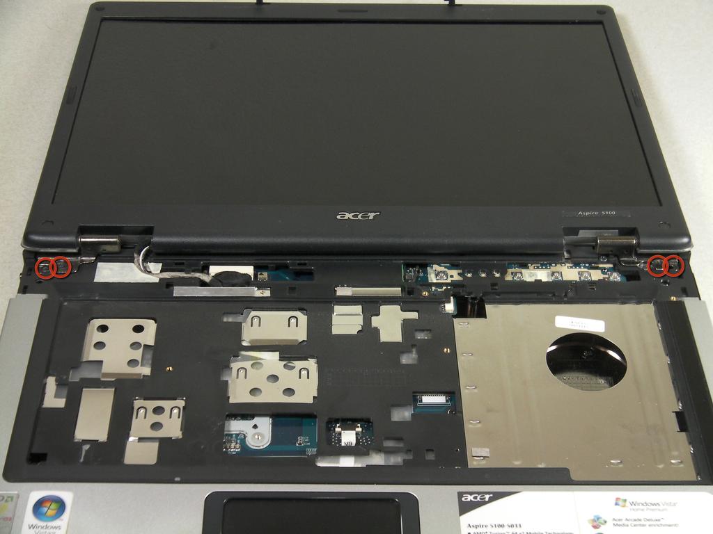 Lift up the bracket that you just unscrewed and remove track pad.