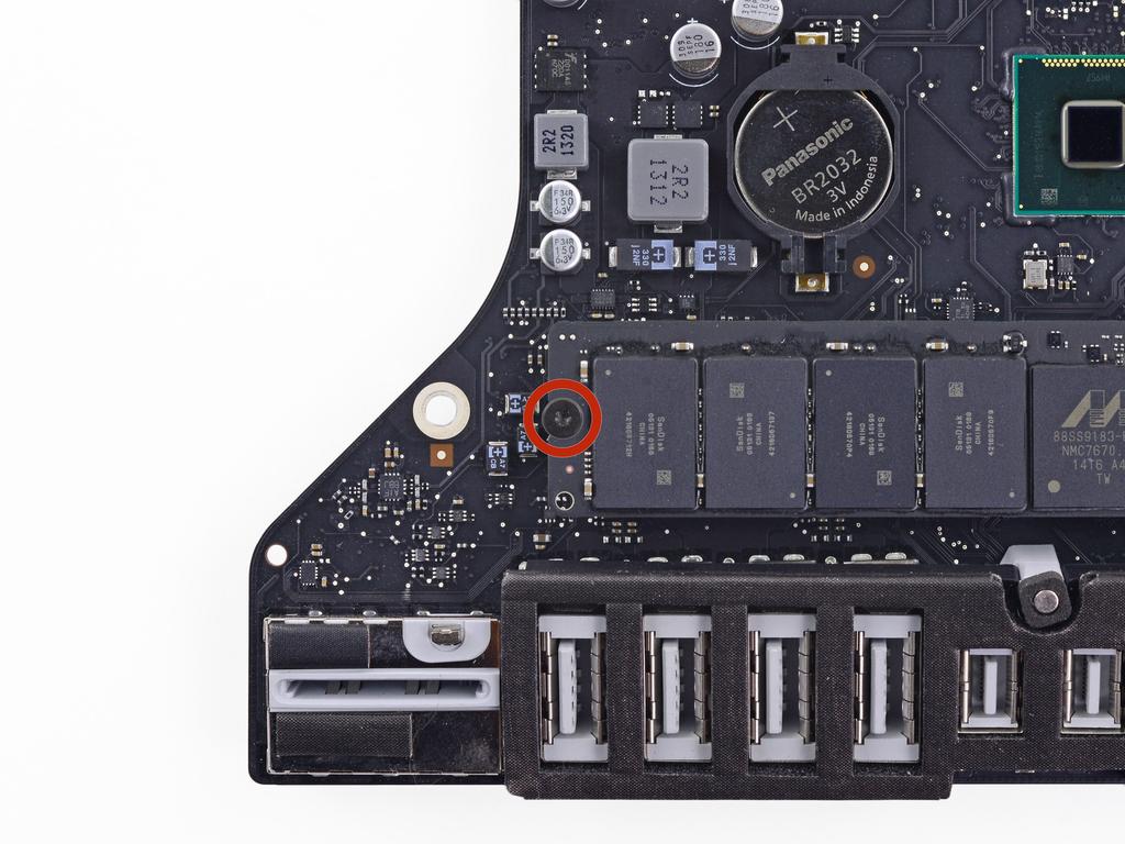 Step 59 Remove the single Torx screw securing the SSD to the logic board.