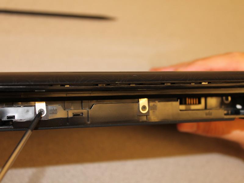 netbook around so that the battery slot is facing you.