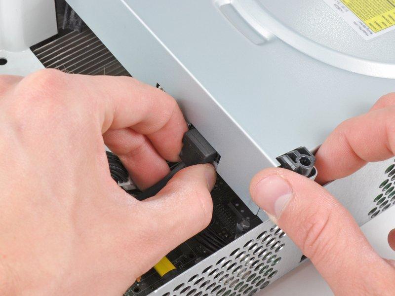 Disconnect the SATA data connector from its socket on the optical drive by