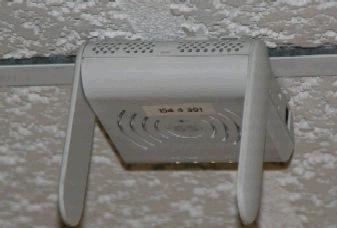 AP65 Access Point, attached to a ceiling tile grid, demonstrating the problem with recessed tiles.