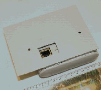 AP65 Access Point, with spacer, attached to a ceiling grid.