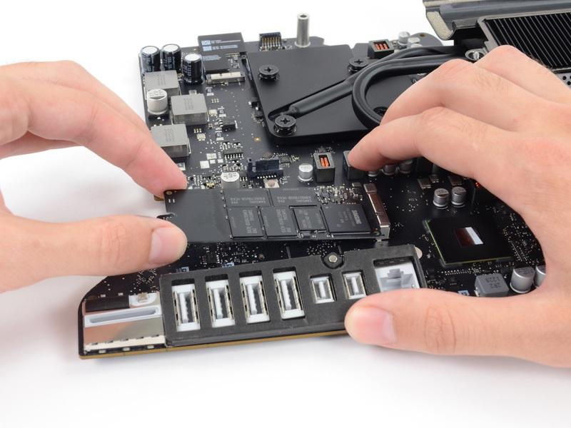 Lift the end of the SSD up slightly and pull it straight out of its socket on the logic board.