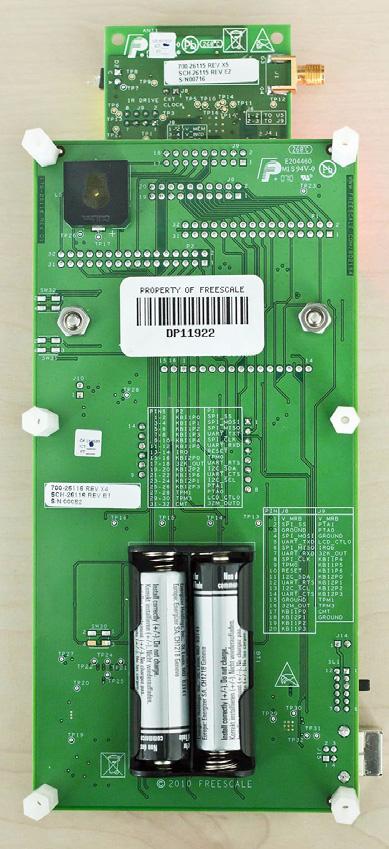 8. Install 2 AA batteries on the back of the 1323x-RCM board as shown in Figure 5.