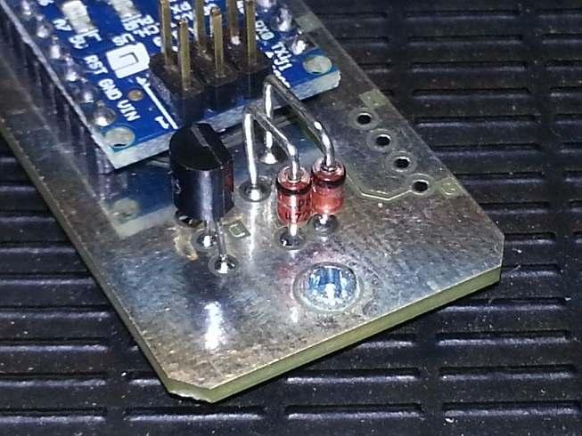 The Mosfet has a flat on it s body. Note: the upside down D etched into the PCB track work.