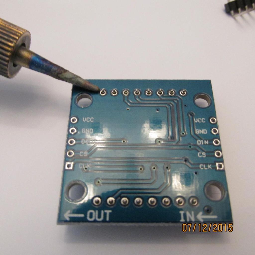 Turn the board over and solder every pin as shown.