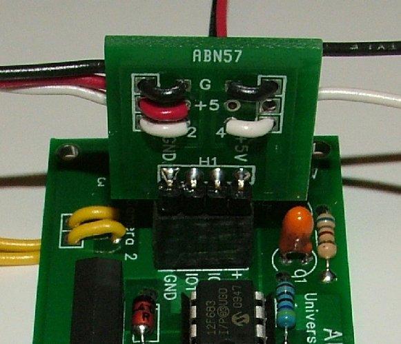 Note that the solder pad marked 2 actually connects that sensor to PICAXE I/O pin #1. Figure 23. The terminator for a sensor array. The wires on the left and right sides connect to sensor PCBs.