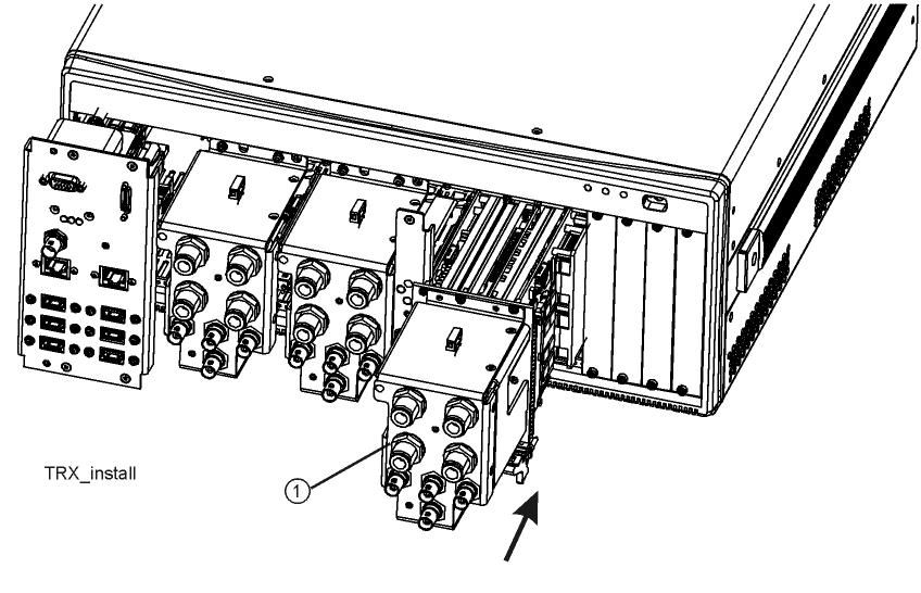 9. Refer to Figure 10. Slide the new TRX module (1) slowly into the open slot of the main frame. The connector side of the module is slightly heavier and will want to tilt down.
