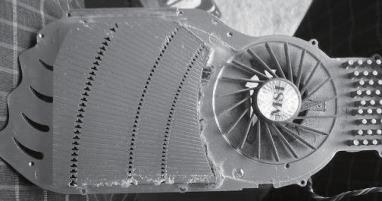 MAINTENANCE AND UPGRADE Illustration: An example of a GPU cooler that is filled with dust and has lost most of its cooling performance.