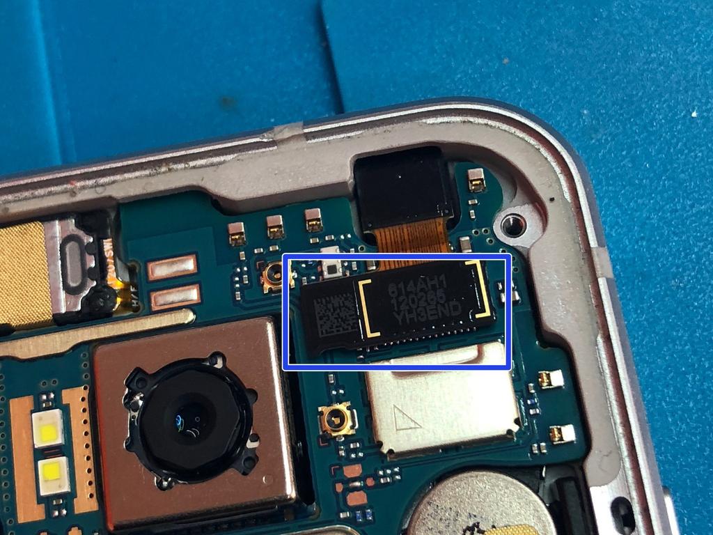 Use the flat end of a spudger to disconnect the charge port flex cable.