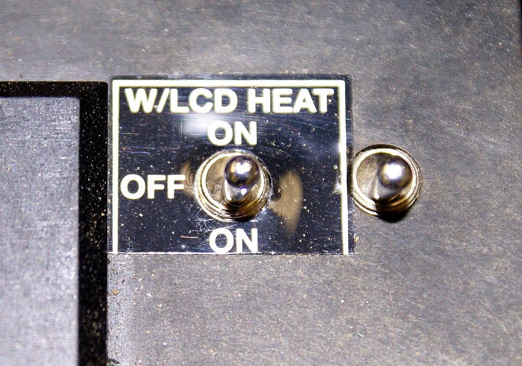 POWER SWITCH: This small 3-Position switch is located on the black lid, lower right corner, adjacent to the LCD Display. The forward position, ON, enables on the LRFB-300 only.