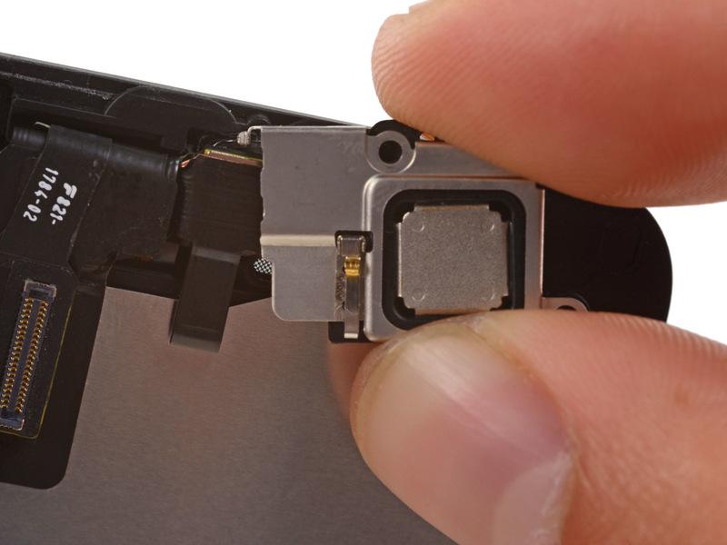 Slide the left hook of the bracket into the notch above the top left corner of the front facing camera.