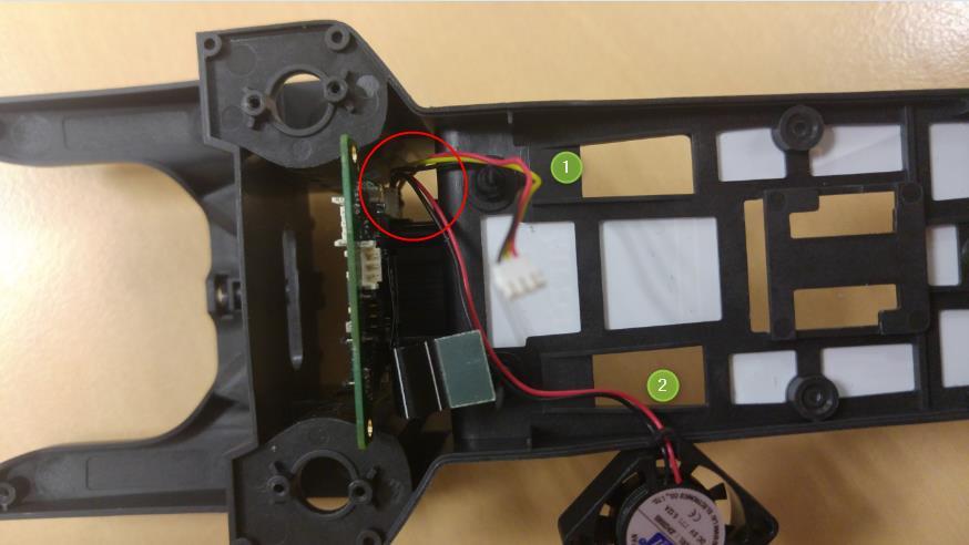 - The LED wire and the ventilator must be placed between the motor card and the support (on the right