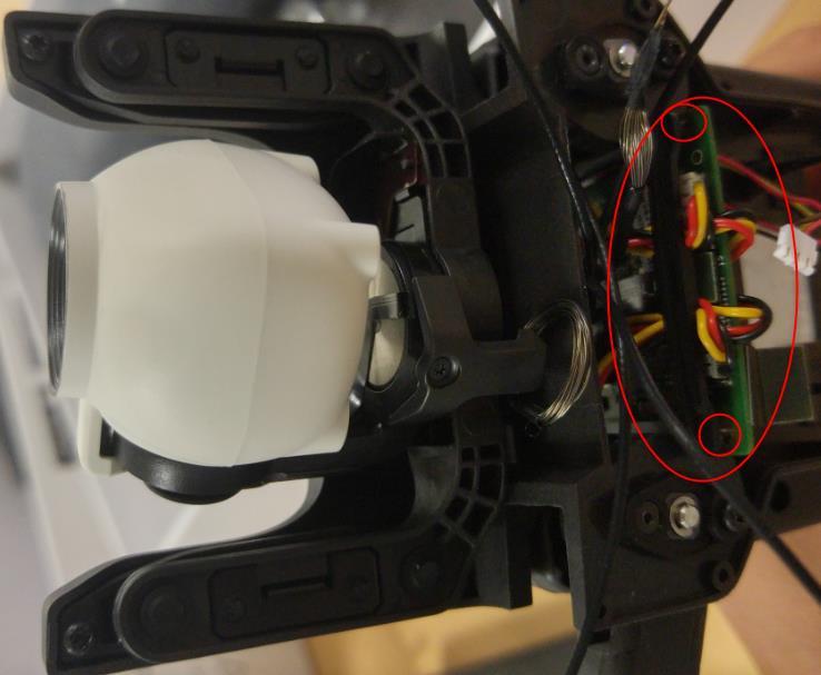 The part with three slots must be on the right side of the drone.