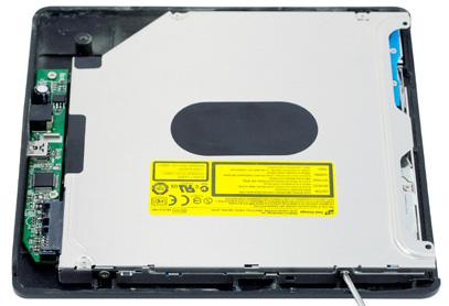 Slide your optical drive into the bottom case, as shown (blue arrow).