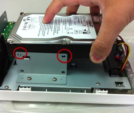 Install the top HDD by attaching it to the