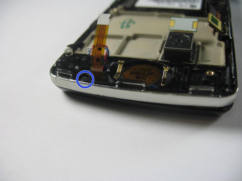 5mm screws on the bottom corners of the device.