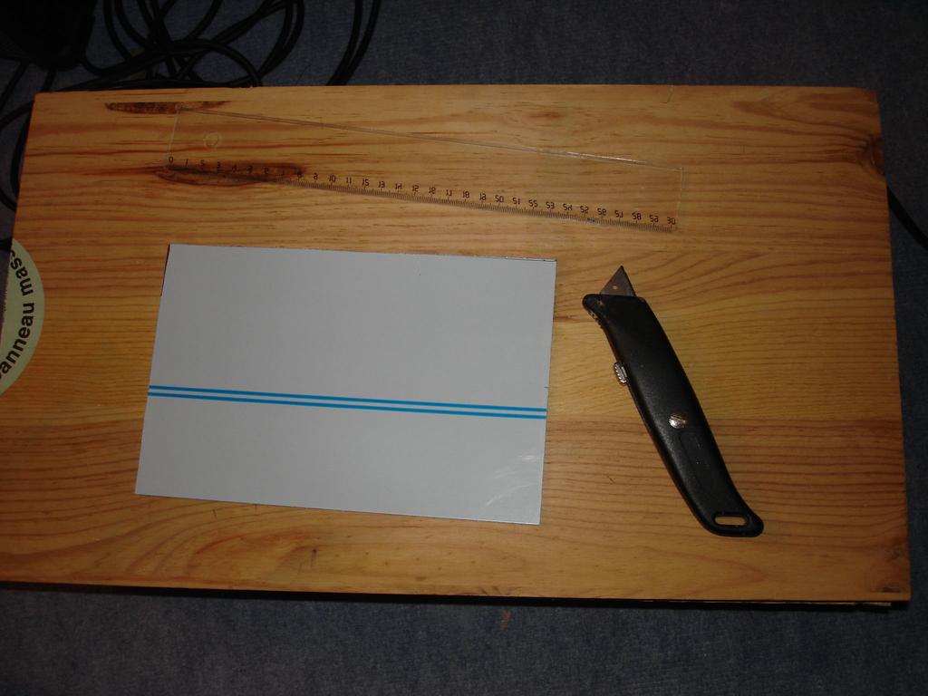 A photo resist copper clad board : it s an epoxy PCB board, covered by a copper layer, the copper layer itself being covered by a photosensitive resist film.