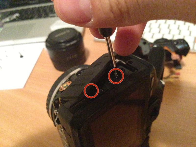 Step 5 Remove the last two screws holding the back of the camera onto the body by removing them from