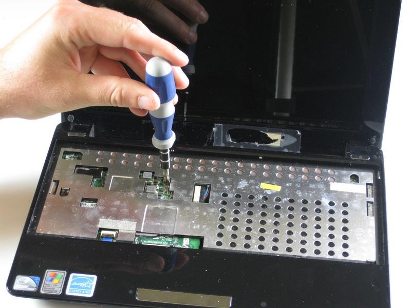 Disconnect the touch pad ribbon cable.