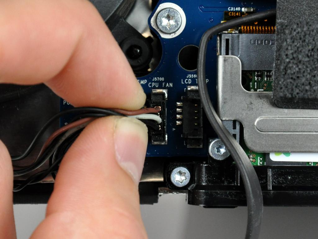 Let the left speaker hang down from the imac, with cables still connected, while removing
