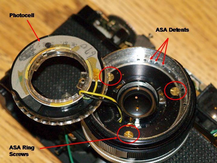 12. Remove the three flat head screws that hold the ASA ring and focus ring in place.