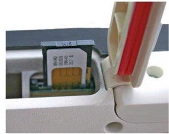 Remove the holder from its compartment. e. Install the SIM card in the card holder making sure it snaps into place. f. With the card in the holder, orient the holder with the card s gold contacts facing down.